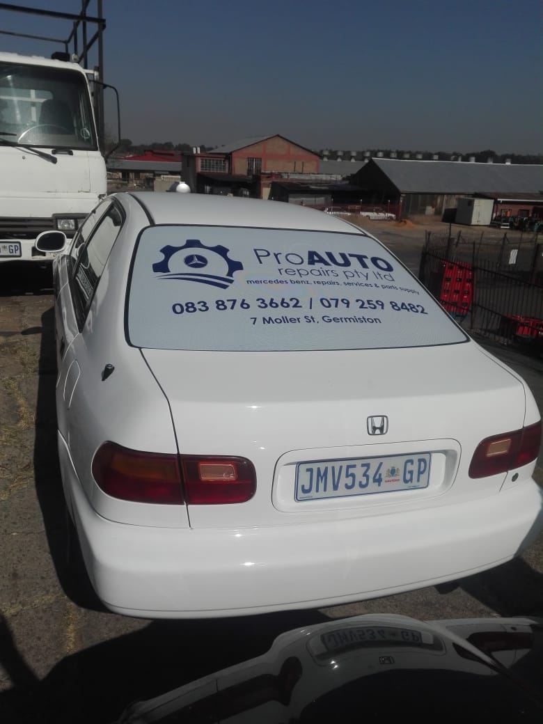 Emergency exit signage with photoluminescent backing