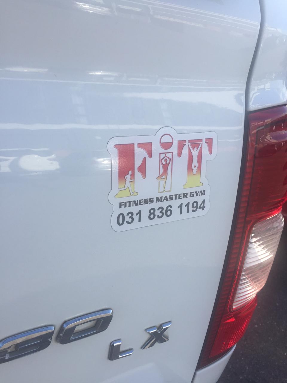 Outdoor pylon sign with backlit branding elements